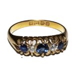 An 18 carat gold five stone sapphire and diamond ring