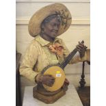 A stoneware figure of a banjo player, the base stamped 4195-5