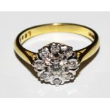 A diamond cluster ring set in 18 carat gold