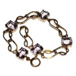 A 9 carat gold bracelet set with amethyst