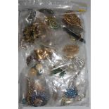 A collection of costume jewellery brooches