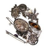 A collection of fourteen silver brooches