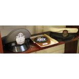 A Thai police hat, a Royal Navy Chief Petty Officer's cap and a plaque for British Transport Police