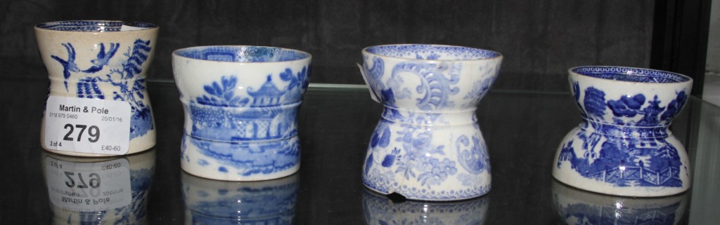 Four 19th century blue and white hollow egg cups, various patterns (4)