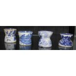 Four 19th century blue and white hollow egg cups, various patterns (4)