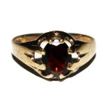 A 9 carat gold and garnet ring