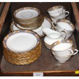 A Tuscan porcelain tea service comprising thirty-four pieces