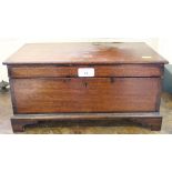 A mahogany rectangular box, the hinged lid enclosing compartments, on bracket feet, 40cm wide
