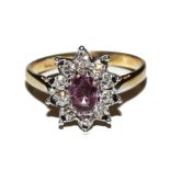 A 9 carat gold, ruby and diamond ring
