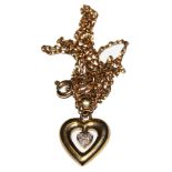 A 9 carat gold and diamond set heart pendant on 9 carat neck chain