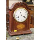 An Edwardian inlaid mahogany mantel clock, the swan neck pediment case with shell motif on brass bun