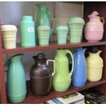 Seven vintage plastic Thermos jugs, four plastic shakers and a flask