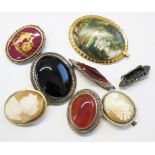 A quantity of agate brooches, two cameo brooches, a gold set Limoge brooch, etc