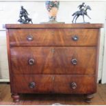 A William IV mahogany chest of drawers, with rounded corners, three graduated drawers and turned
