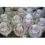 A Colclough china tea service, comprising cups, saucers and side plates for eleven place settings,