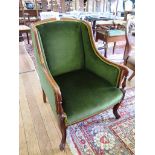 An early 20th century mahogany armchair, the arched padded back and arms with balustered turned