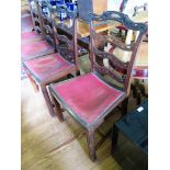 A set of four George III style ladder back dining chairs, the pierced rails over dished seats on
