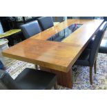 A walnut dining table, the rectangular top with tinted glass centre on rectangular supports, 90cm