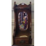 A stained glass octagonal wall mirror with bevelled plate and ribbon design, 48cm square and another