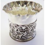 A silver flower pot holder