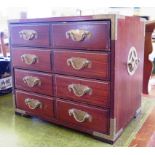 A Chinese hardwood and brass bound jewellery box with four silk lined drawers and brass handles,