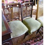 A pair of Edwardian side chairs, the anthemion decorated top rails above rail backs depicting urns