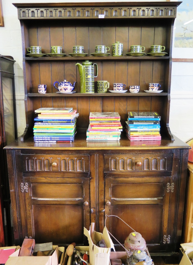 An oak dresser and rack, the fluted cornice over two shelves, the base with two fluted frieze