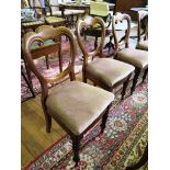 A set of three Victorian balloon back dining chairs, with scrolled top rails, overstuffed seats