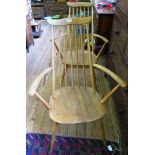 A pair of Ercol beech and elm Windsor armchairs stamped with BS 1960 kite mark C.F. 2056 (2)