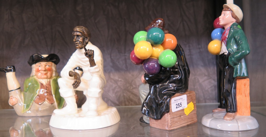 Royal Doulton 'The Balloon Boy', HN2934, 19.5cm high; 'The Balloon Man', HN1954, 18cm high; a Minton