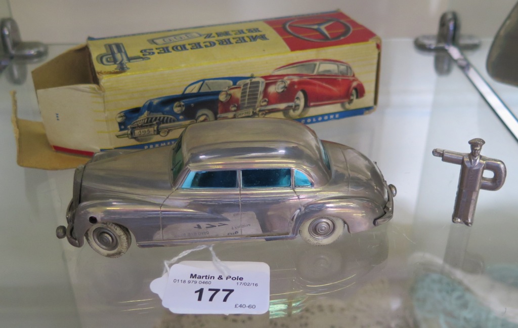 A Prameta clockwork Mercedes-Benz 300, chrome with blue tinted windows in original box with point-