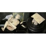 A late 19th century Japanese ivory okimono of a seated man, on a later Chinese base, figure 13cm