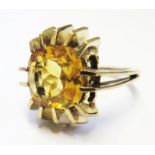 A 9 carat gold ring set with a central citrine