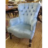 A Victorian style upholstered lady's armchair, the button upholstered back above turned tapering