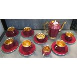 A Wade coffee service, with crimson fluted sides and gilded interiors, six cups and saucers,