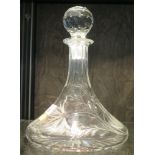 A cut glass ships decanter, with faceted stopper, the decanter etched and cut with floral motifs,