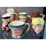 A Royal Doulton character jug, Tony Mellor, 18cm high, four other character jugs and a Toby jug (6)