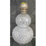 A cut glass double gourd shape Victorian scent bottle with silver top