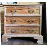 A pine chest of drawers, with three long drawers on bracket feet, 71cm wide