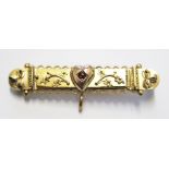 A 9 carat gold bar brooch set with a garnet