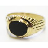 A gents 9 carat gold and black onyx ring