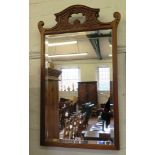 An Edwardian mahogany wall mirror, formerly from a dressing table, the shaped pierced top rail