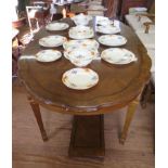 A French provincial style walnut dining room suite, comprising shaped oval extending dining table,