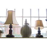 A turned oak table lamp with leaf decoration and turned base, 26cm high, another similar and a