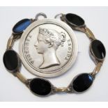 A silver Victorian spinning medallion and a silver black and agate bracelet