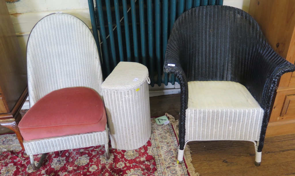 A Lloyd Loom nursing chair, on a cantilevered base, a Lloyd Loom armchair, and a Lloyd Loom