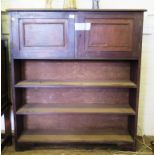 A mahogany open bookcase, with two panelled doors enclosing sheet music compartments over three open