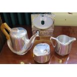A Picquot ware three piece tea service, of organic form and a Wedgwood photo frame with jasper