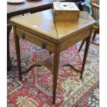 An Edwardian mahogany envelope games table, the square hinged top enclosing a bare interior (lacks