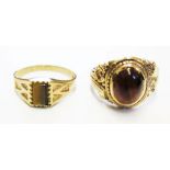 Two 9 carat gold rings set with tigers eye